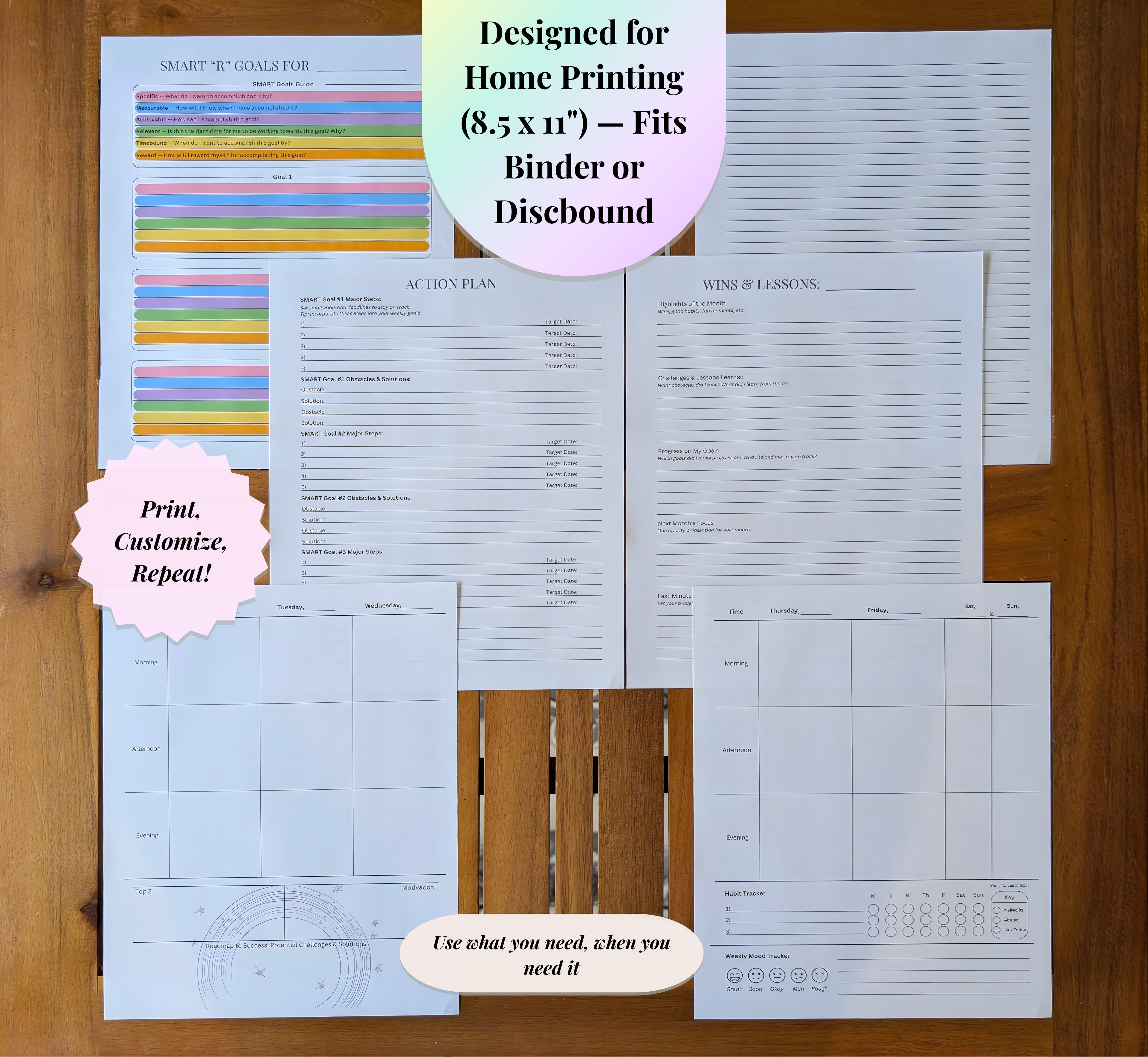 Printed planner pages laid out on a wooden table, showing SMART goals, action plan, and weekly layouts from the NeuroMythical Printable Planner